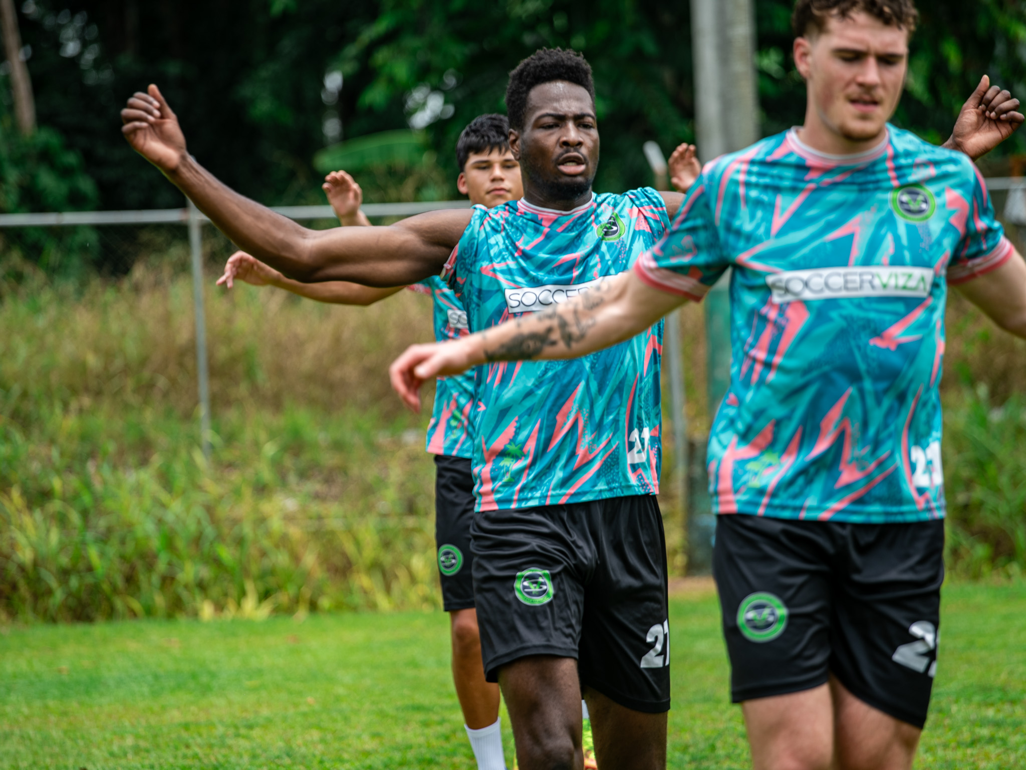 Player stretching in Wolaba jersey